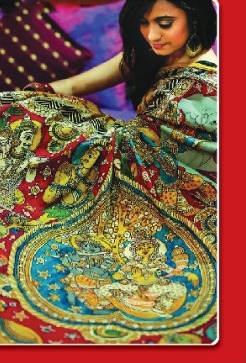 Model draping a hand-painted red and blue Kalamkari saree with mythological motifs